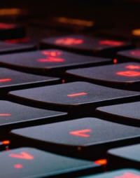 A group of laptops arranged neatly.